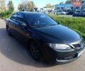 Черный Мазда 6, объемом двигателя 2 л и пробегом 254 тыс. км за 4800 $, фото 1 на Automoto.ua