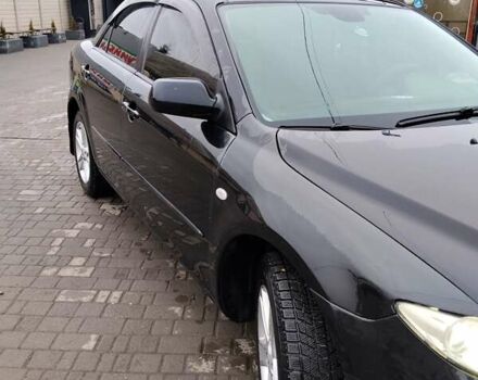 Черный Мазда 6, объемом двигателя 2 л и пробегом 190 тыс. км за 4600 $, фото 1 на Automoto.ua