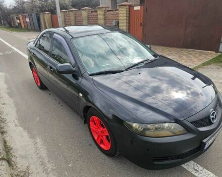Черный Мазда 6, объемом двигателя 2 л и пробегом 310 тыс. км за 4000 $, фото 1 на Automoto.ua