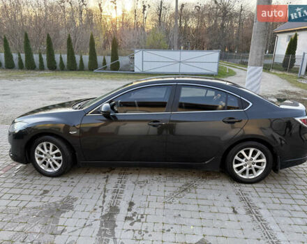 Черный Мазда 6, объемом двигателя 2 л и пробегом 309 тыс. км за 6200 $, фото 1 на Automoto.ua