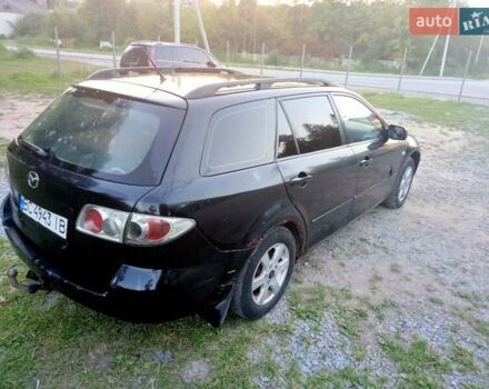 Черный Мазда 6, объемом двигателя 2 л и пробегом 445 тыс. км за 1750 $, фото 1 на Automoto.ua