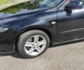 Черный Мазда 6, объемом двигателя 2 л и пробегом 210 тыс. км за 4400 $, фото 4 на Automoto.ua