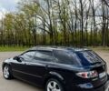 Черный Мазда 6, объемом двигателя 2 л и пробегом 246 тыс. км за 5700 $, фото 1 на Automoto.ua