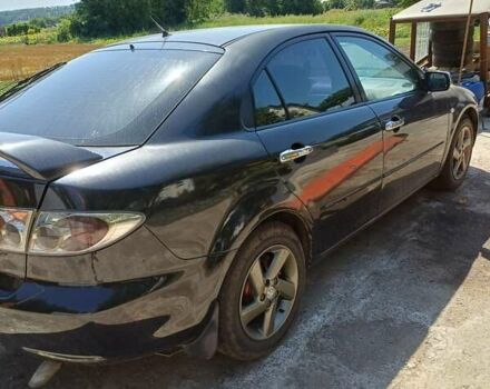 Черный Мазда 6, объемом двигателя 2 л и пробегом 388 тыс. км за 3800 $, фото 1 на Automoto.ua