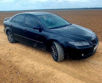 Черный Мазда 6, объемом двигателя 1.8 л и пробегом 222 тыс. км за 2200 $, фото 1 на Automoto.ua