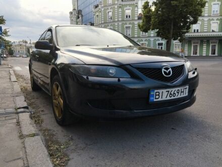 Черный Мазда 6, объемом двигателя 2 л и пробегом 320 тыс. км за 4700 $, фото 1 на Automoto.ua
