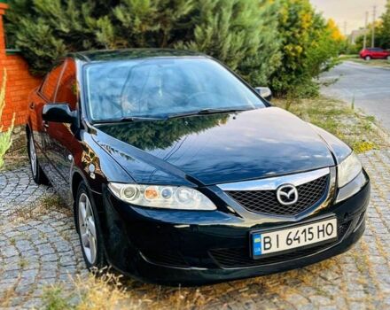 Черный Мазда 6, объемом двигателя 2 л и пробегом 210 тыс. км за 4650 $, фото 1 на Automoto.ua