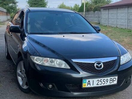 Черный Мазда 6, объемом двигателя 2 л и пробегом 375 тыс. км за 3900 $, фото 1 на Automoto.ua