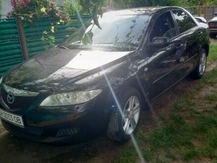 Черный Мазда 6, объемом двигателя 2 л и пробегом 280 тыс. км за 4400 $, фото 1 на Automoto.ua