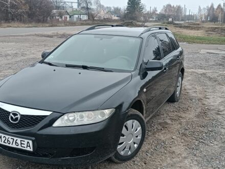 Черный Мазда 6, объемом двигателя 2 л и пробегом 320 тыс. км за 3600 $, фото 1 на Automoto.ua