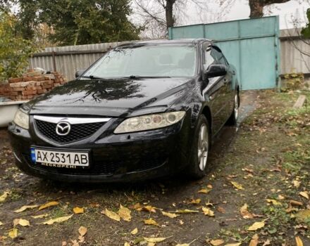 Черный Мазда 6, объемом двигателя 2 л и пробегом 257 тыс. км за 5500 $, фото 1 на Automoto.ua