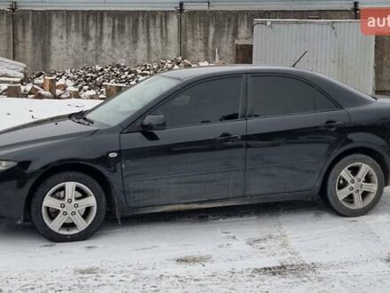 Черный Мазда 6, объемом двигателя 2 л и пробегом 180 тыс. км за 5400 $, фото 1 на Automoto.ua