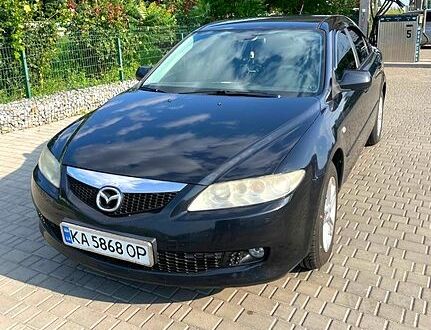 Черный Мазда 6, объемом двигателя 2 л и пробегом 316 тыс. км за 4000 $, фото 1 на Automoto.ua