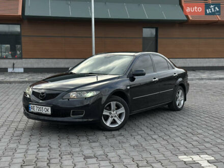 Черный Мазда 6, объемом двигателя 2 л и пробегом 253 тыс. км за 5800 $, фото 1 на Automoto.ua
