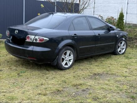 Черный Мазда 6, объемом двигателя 1.8 л и пробегом 245 тыс. км за 1650 $, фото 1 на Automoto.ua