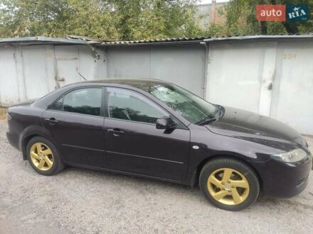 Черный Мазда 6, объемом двигателя 2 л и пробегом 187 тыс. км за 7000 $, фото 1 на Automoto.ua