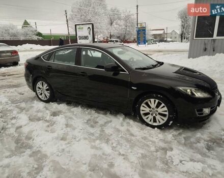 Черный Мазда 6, объемом двигателя 2 л и пробегом 247 тыс. км за 5800 $, фото 1 на Automoto.ua