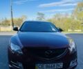 Красный Мазда 6, объемом двигателя 2 л и пробегом 246 тыс. км за 8424 $, фото 1 на Automoto.ua