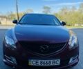 Красный Мазда 6, объемом двигателя 2 л и пробегом 246 тыс. км за 8424 $, фото 1 на Automoto.ua