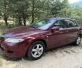 Красный Мазда 6, объемом двигателя 2 л и пробегом 245 тыс. км за 2951 $, фото 1 на Automoto.ua