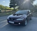 Красный Мазда 6, объемом двигателя 2 л и пробегом 267 тыс. км за 3750 $, фото 1 на Automoto.ua