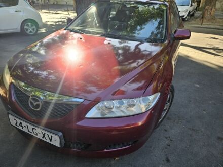 Красный Мазда 6, объемом двигателя 2 л и пробегом 303 тыс. км за 1750 $, фото 1 на Automoto.ua