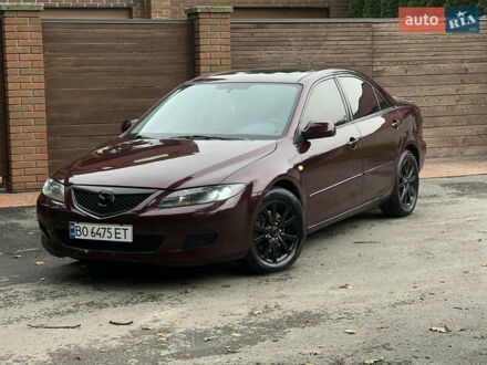 Красный Мазда 6, объемом двигателя 2.3 л и пробегом 250 тыс. км за 4400 $, фото 1 на Automoto.ua