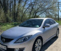 Серый Мазда 6, объемом двигателя 2 л и пробегом 230 тыс. км за 6800 $, фото 1 на Automoto.ua