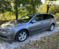 Серый Мазда 6, объемом двигателя 2 л и пробегом 311 тыс. км за 4200 $, фото 1 на Automoto.ua