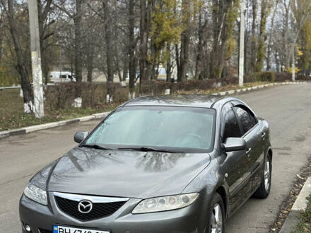 Серый Мазда 6, объемом двигателя 2 л и пробегом 243 тыс. км за 4200 $, фото 1 на Automoto.ua