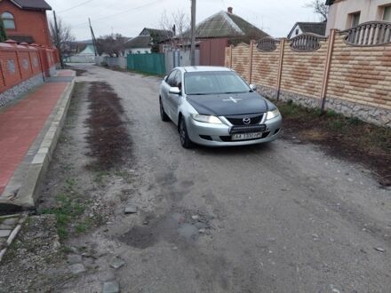 Серый Мазда 6, объемом двигателя 2 л и пробегом 380 тыс. км за 1467 $, фото 1 на Automoto.ua