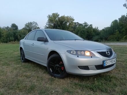Серый Мазда 6, объемом двигателя 2 л и пробегом 375 тыс. км за 2002 $, фото 1 на Automoto.ua