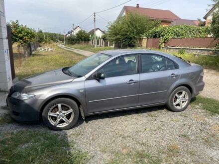 Серый Мазда 6, объемом двигателя 2 л и пробегом 325 тыс. км за 3550 $, фото 1 на Automoto.ua