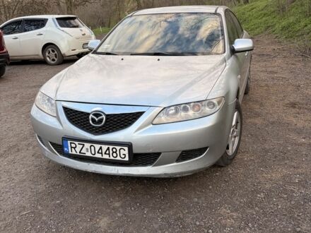 Серый Мазда 6, объемом двигателя 2 л и пробегом 300 тыс. км за 1900 $, фото 1 на Automoto.ua