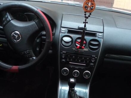 Серый Мазда 6, объемом двигателя 2 л и пробегом 323 тыс. км за 4400 $, фото 1 на Automoto.ua