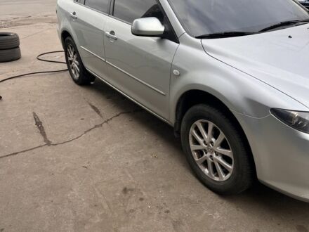 Серый Мазда 6, объемом двигателя 1.8 л и пробегом 165 тыс. км за 949 $, фото 1 на Automoto.ua