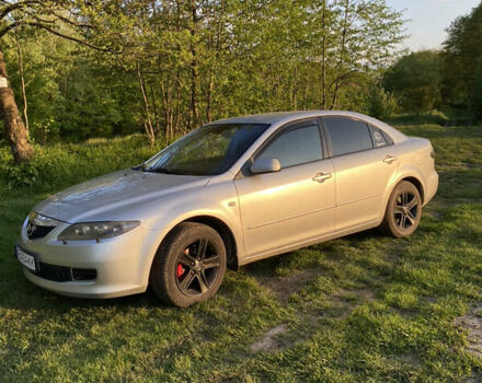 Серый Мазда 6, объемом двигателя 2 л и пробегом 244 тыс. км за 6000 $, фото 1 на Automoto.ua