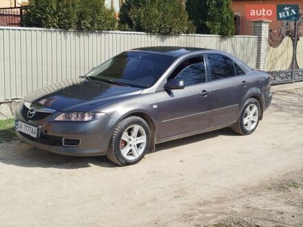 Серый Мазда 6, объемом двигателя 2 л и пробегом 245 тыс. км за 4150 $, фото 1 на Automoto.ua