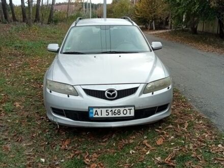 Серый Мазда 6, объемом двигателя 2 л и пробегом 247 тыс. км за 4000 $, фото 1 на Automoto.ua
