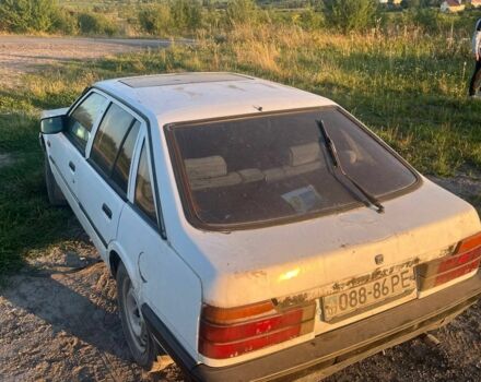 Белый Мазда 626, объемом двигателя 2 л и пробегом 350 тыс. км за 291 $, фото 6 на Automoto.ua