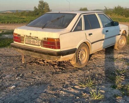 Белый Мазда 626, объемом двигателя 2 л и пробегом 350 тыс. км за 291 $, фото 4 на Automoto.ua