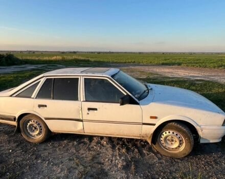 Белый Мазда 626, объемом двигателя 2 л и пробегом 350 тыс. км за 291 $, фото 1 на Automoto.ua