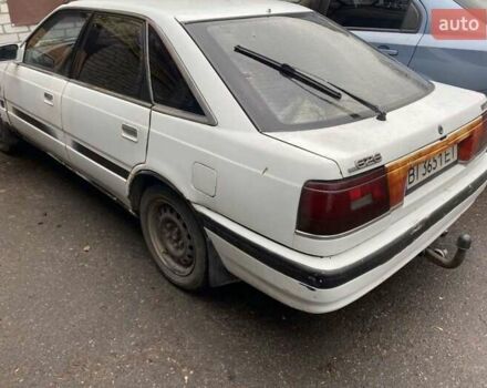 Белый Мазда 626, объемом двигателя 2 л и пробегом 400 тыс. км за 600 $, фото 1 на Automoto.ua