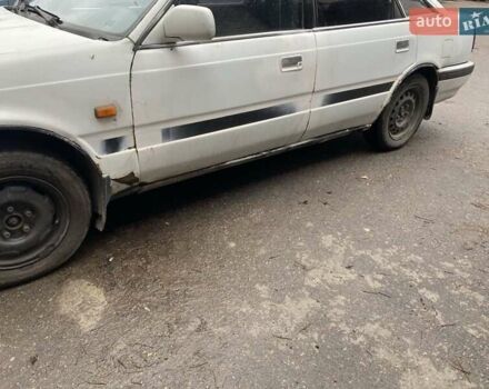 Белый Мазда 626, объемом двигателя 2 л и пробегом 400 тыс. км за 600 $, фото 7 на Automoto.ua