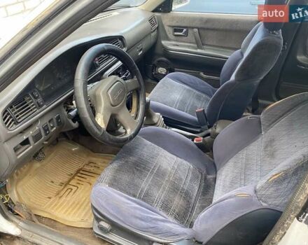 Белый Мазда 626, объемом двигателя 2 л и пробегом 400 тыс. км за 600 $, фото 4 на Automoto.ua