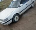 Белый Мазда 626, объемом двигателя 2 л и пробегом 400 тыс. км за 1102 $, фото 1 на Automoto.ua