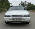 Белый Мазда 626, объемом двигателя 2 л и пробегом 470 тыс. км за 999 $, фото 1 на Automoto.ua