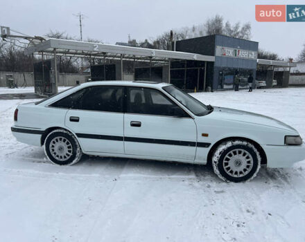 Белый Мазда 626, объемом двигателя 2 л и пробегом 330 тыс. км за 1500 $, фото 2 на Automoto.ua