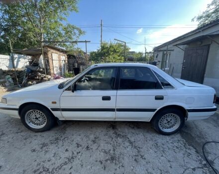 Белый Мазда 626, объемом двигателя 2 л и пробегом 429 тыс. км за 953 $, фото 2 на Automoto.ua