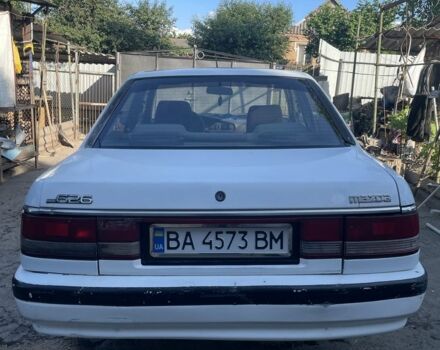 Белый Мазда 626, объемом двигателя 2 л и пробегом 429 тыс. км за 953 $, фото 1 на Automoto.ua